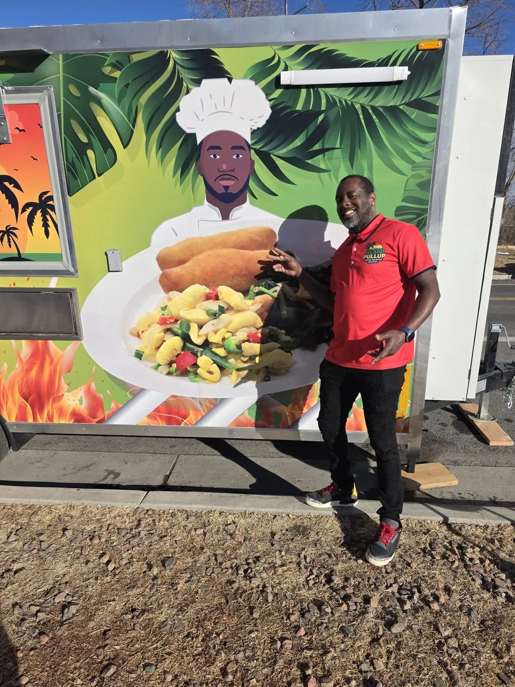 Kevin Buchanan in front of the Island Pullup truck wrap