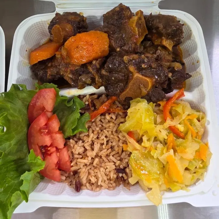 Oxtail with rice and peas and cabbage