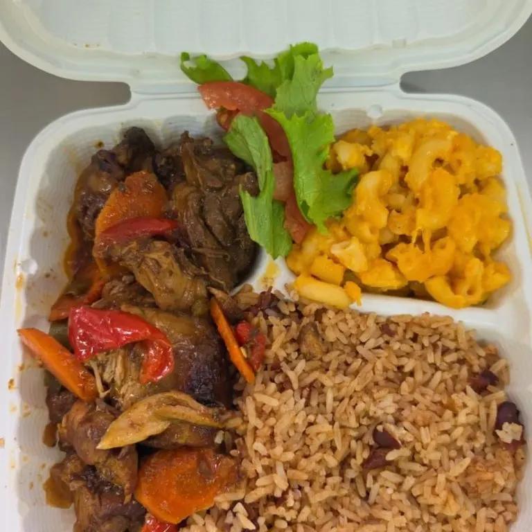 Brown stew chicken with rice and peas and macaroni and cheese